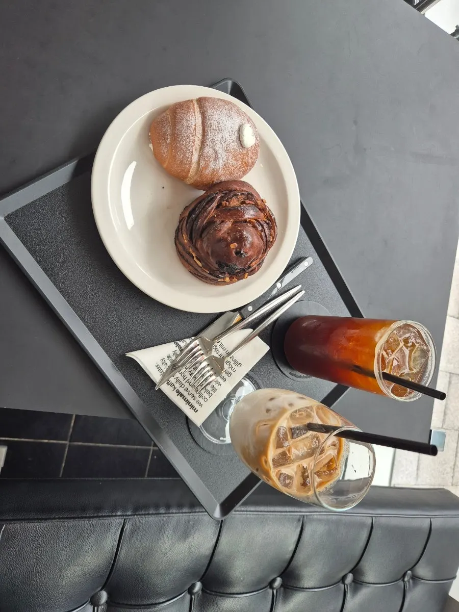 Table with ordered drinks and bread