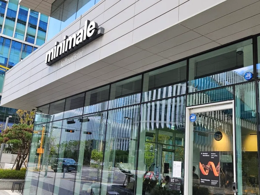 Exterior of Minimale café at Gwacheon E-Tower under an autumn sky