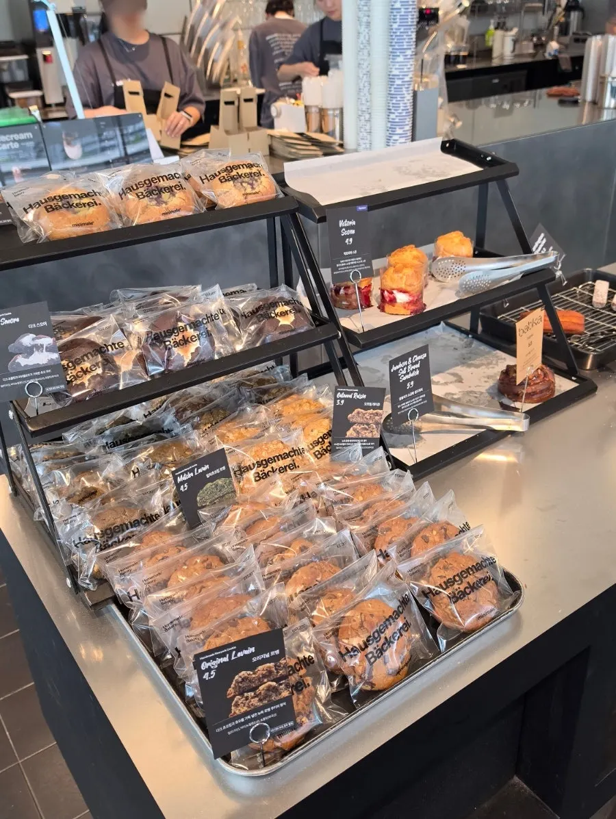 Display case with thick cookies and other baked goods