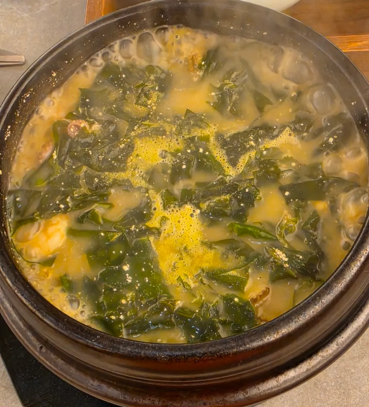Tot-bap studded with seaweed alongside basic banchan
