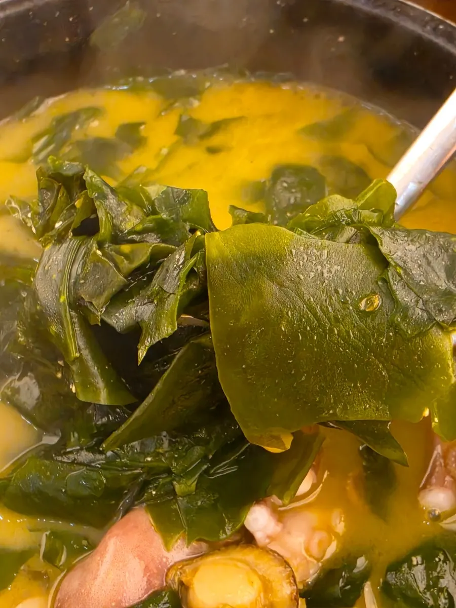A spoonful of broth from Haenon Miyeok's Haesin seaweed soup