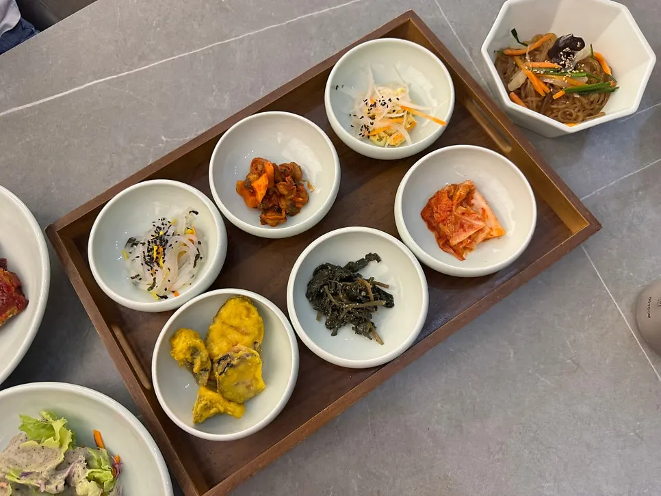 Plate of chicken breast salad and namul banchan