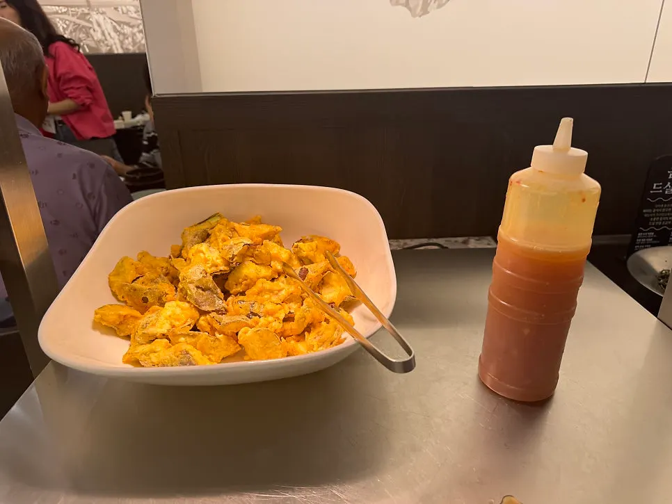 Yeolmu kimchi and japchae at the self-serve bar