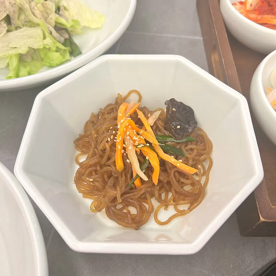 A plate of japchae served as a side dish
