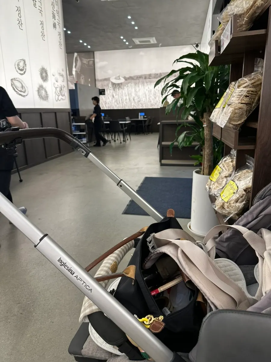 Wide table with a stroller placed beside it