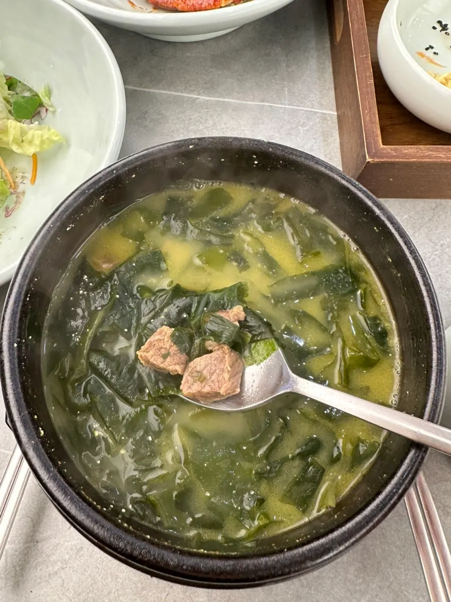 Table setting with unlimited-refill rice and seaweed soup