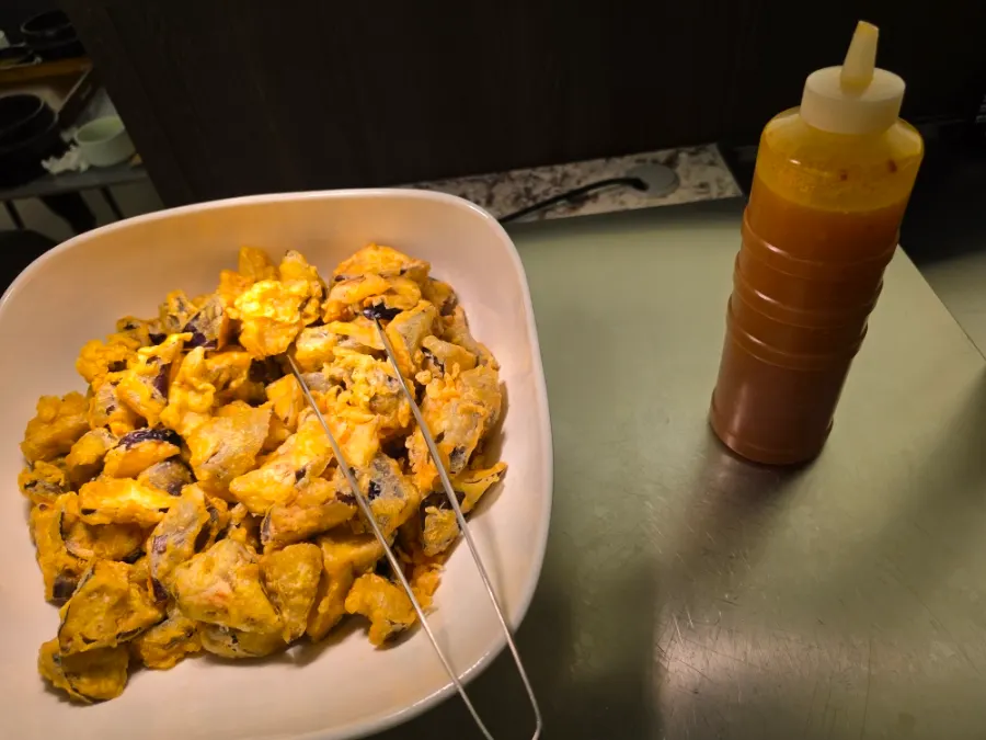 Side dish containers set out at the self-serve bar
