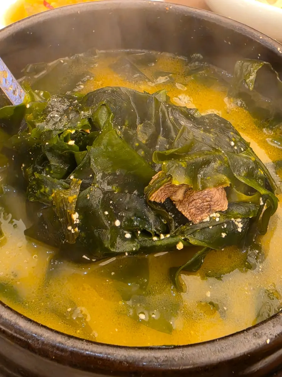 Seaweed soup bubbling in a stone pot