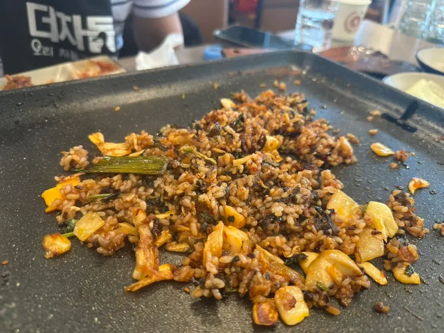 Crispy fried rice stuck to the grill
