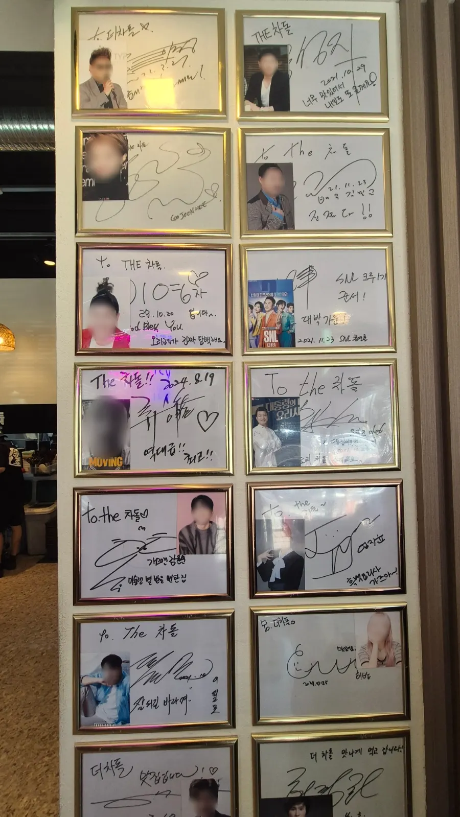 Celebrity autographs hung on the restaurant wall