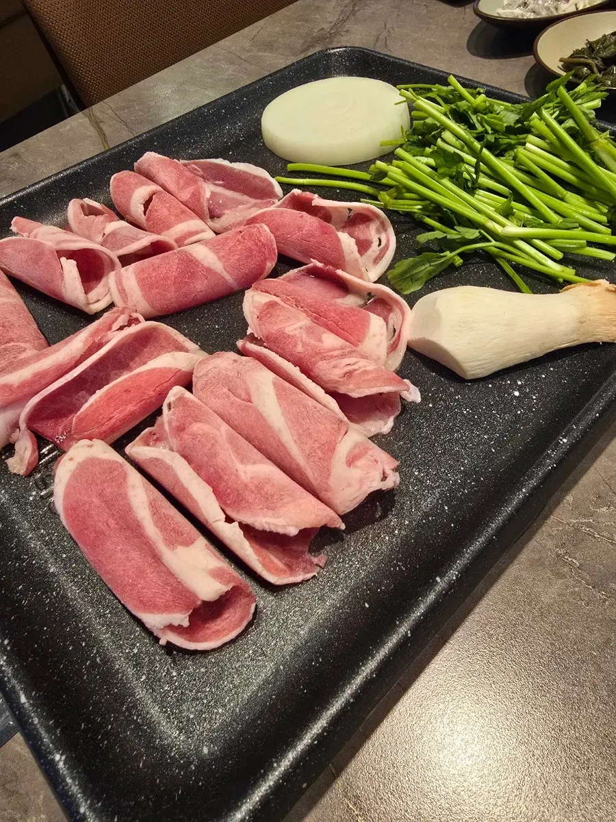 A plate of vivid red raw duck chadol