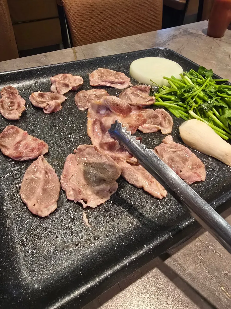 A piece of duck chadol placed on a toddler's bowl of rice