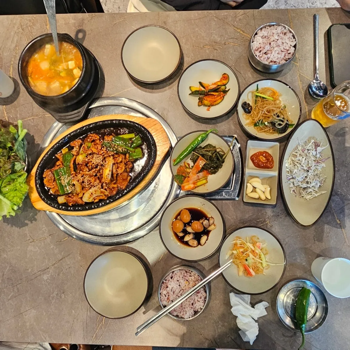 Full spread of the duck jeyuk set at Deo Chadol Gwacheon