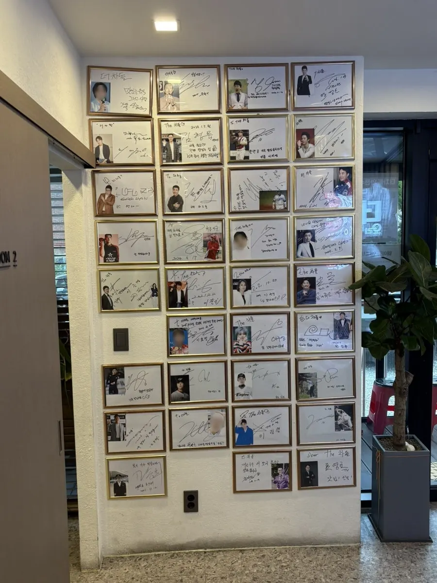 Wall covered with celebrity autographs