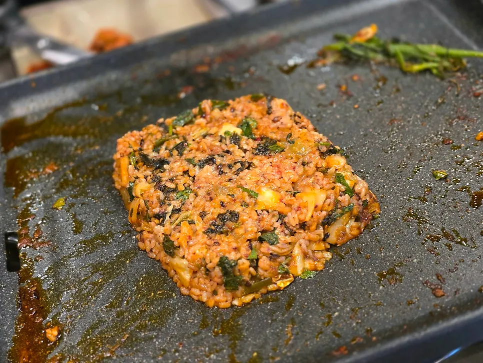 Fried rice ingredients added to leftover stir-fry sauce