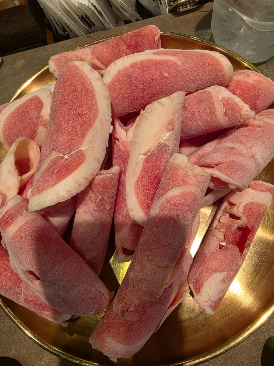 Bright red duck chadol on the grill