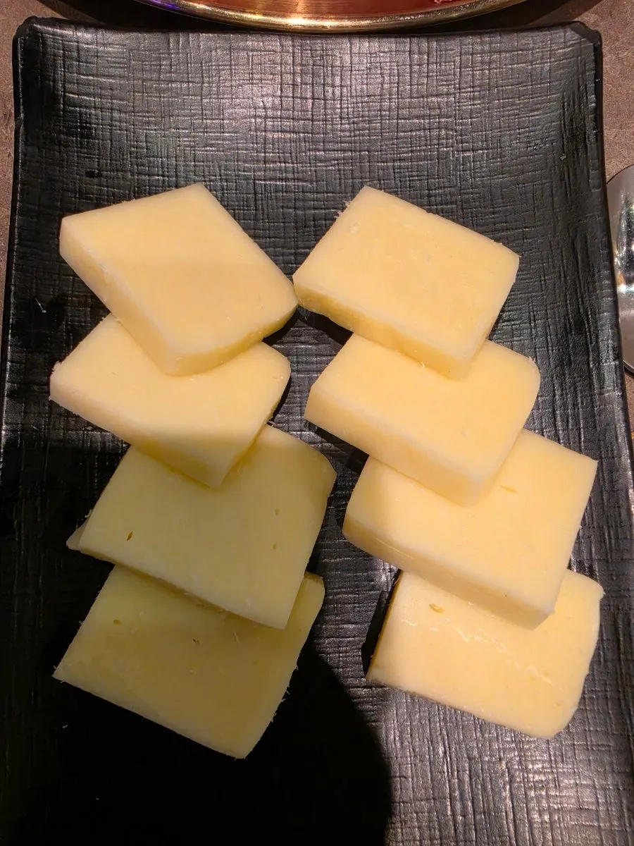Cheese grilling on one side of the pan