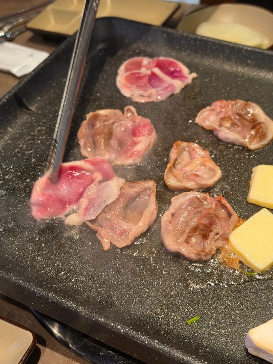 Grillable cheese with a piece of duck meat