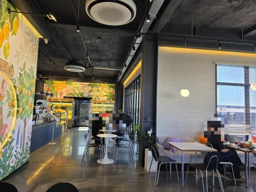 Café space with white walls and a black ceiling