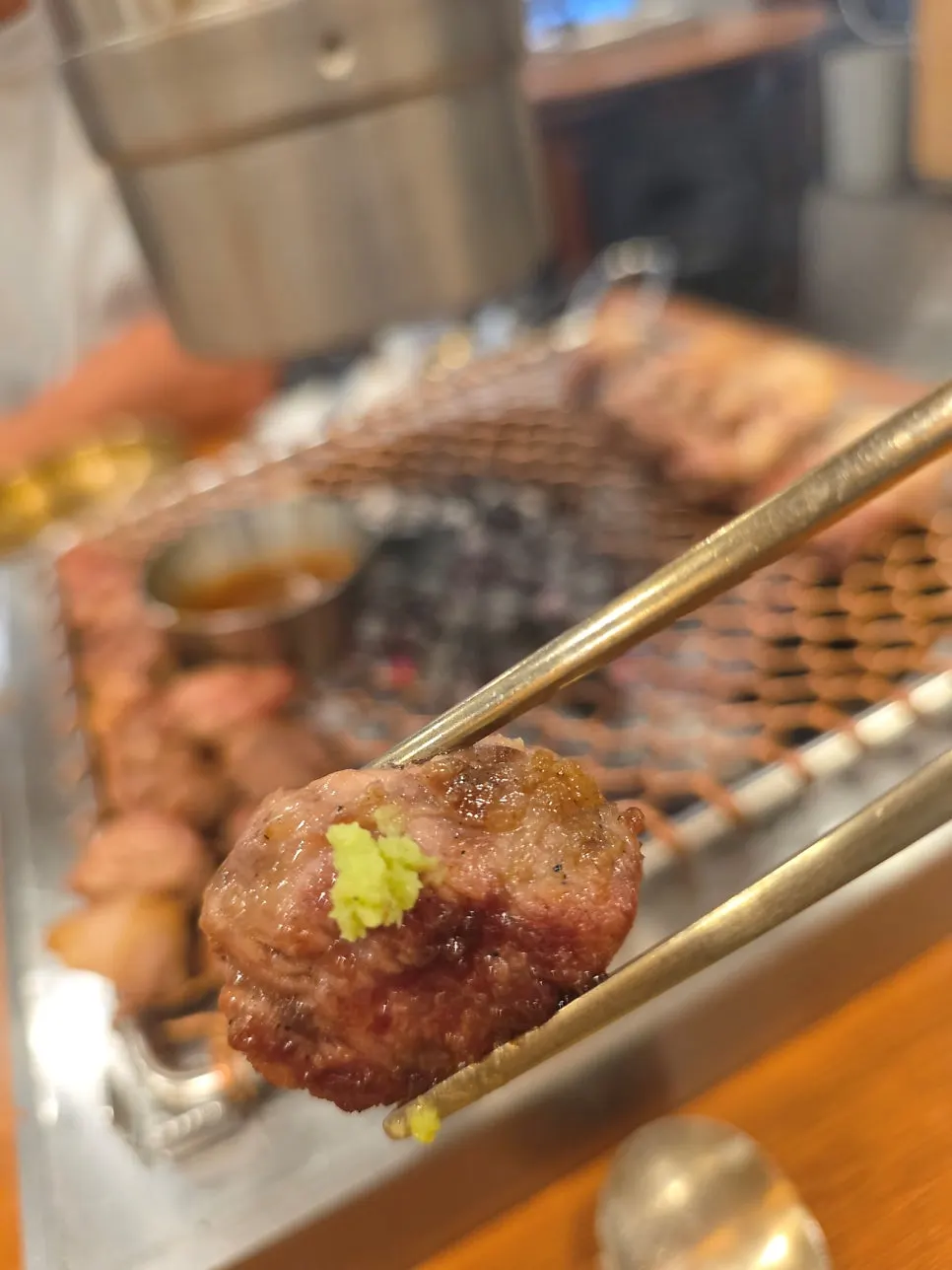 Staff grilling black pork for the table