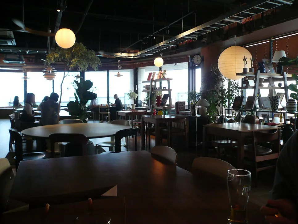 Interior with sea view spread beyond the floor-to-ceiling windows
