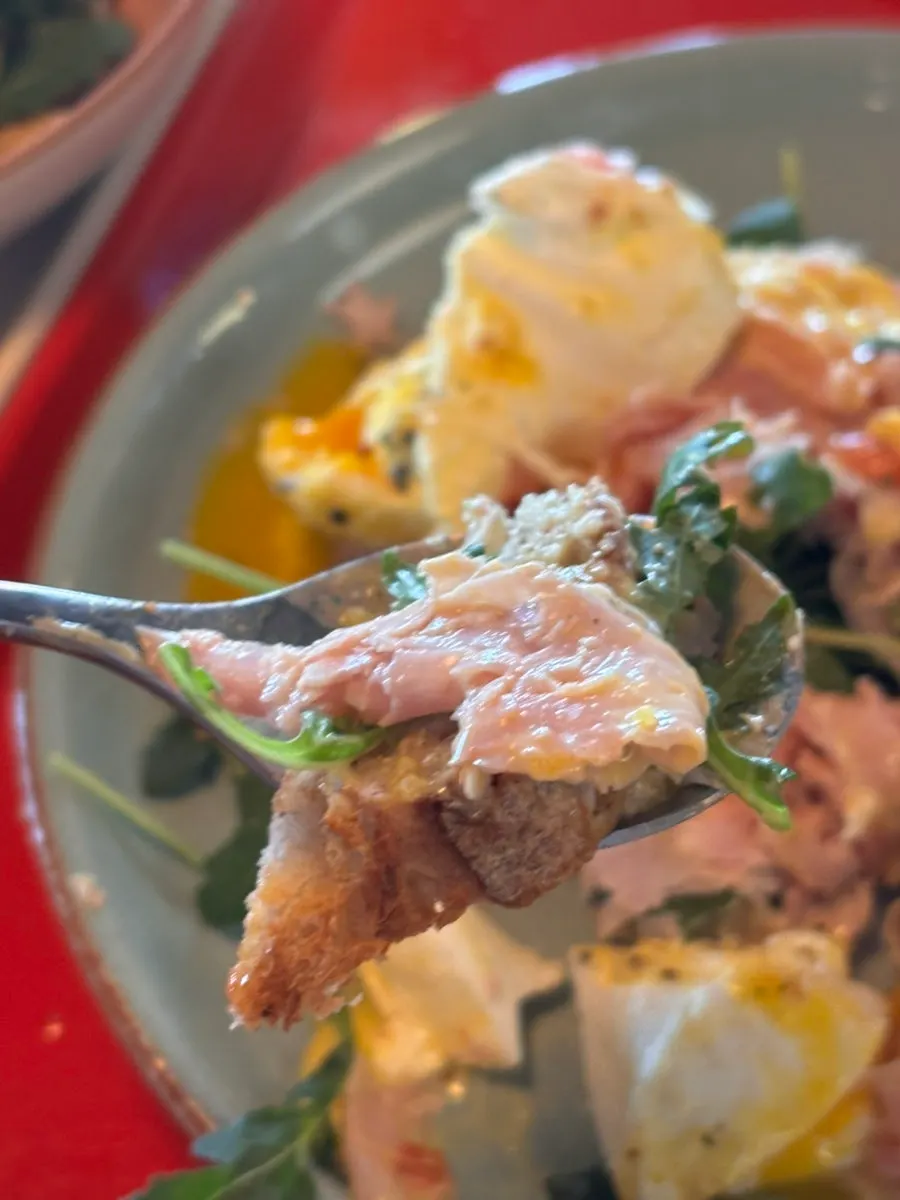 Poached egg and sauce on golden-toasted bread