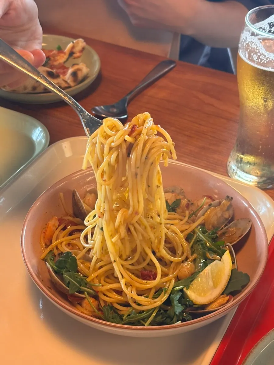 Close-up of aglio olio noodles soaked in oil