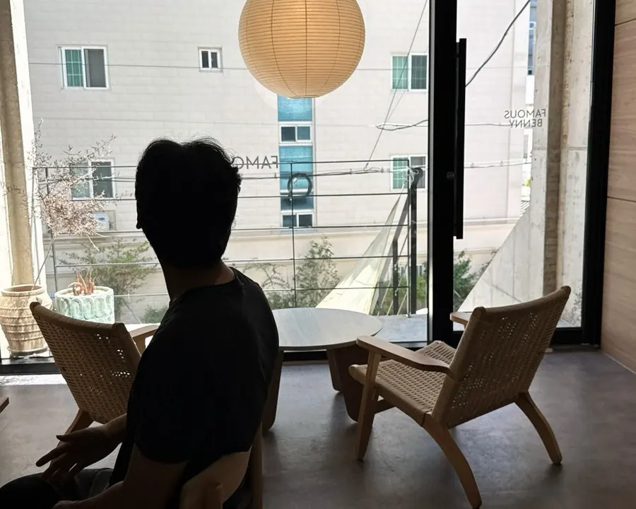Second-floor window seats facing full glass windows