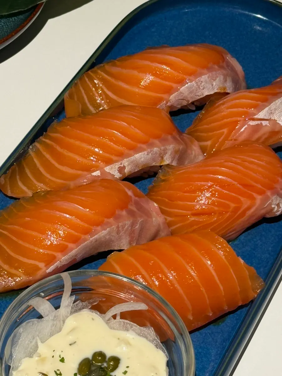 Close-up of a single piece of raw salmon sushi
