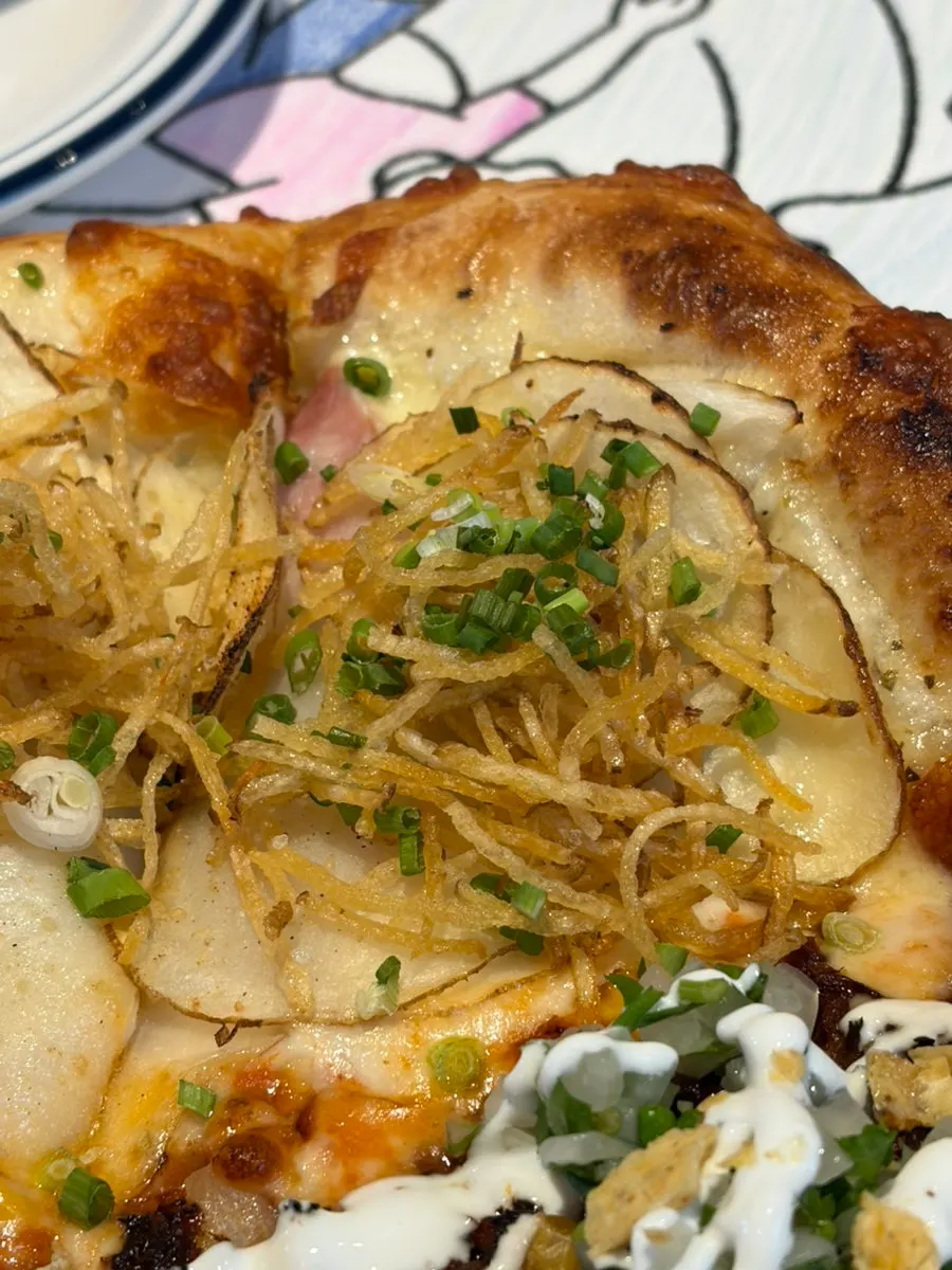 Birria pizza reinterpreting tacos