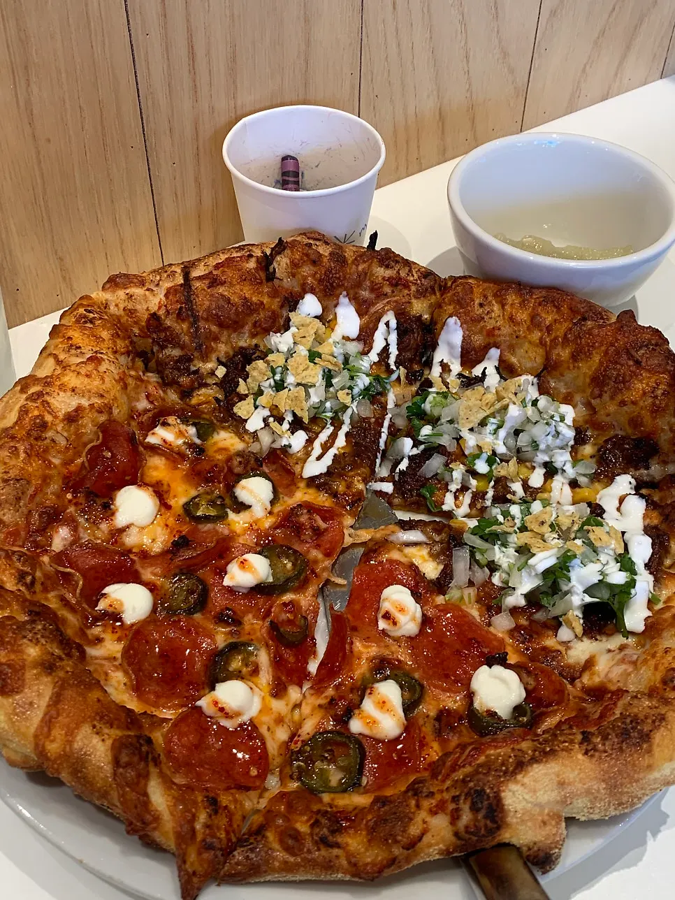 Half hot honey pepperoni, half birria taco pizza