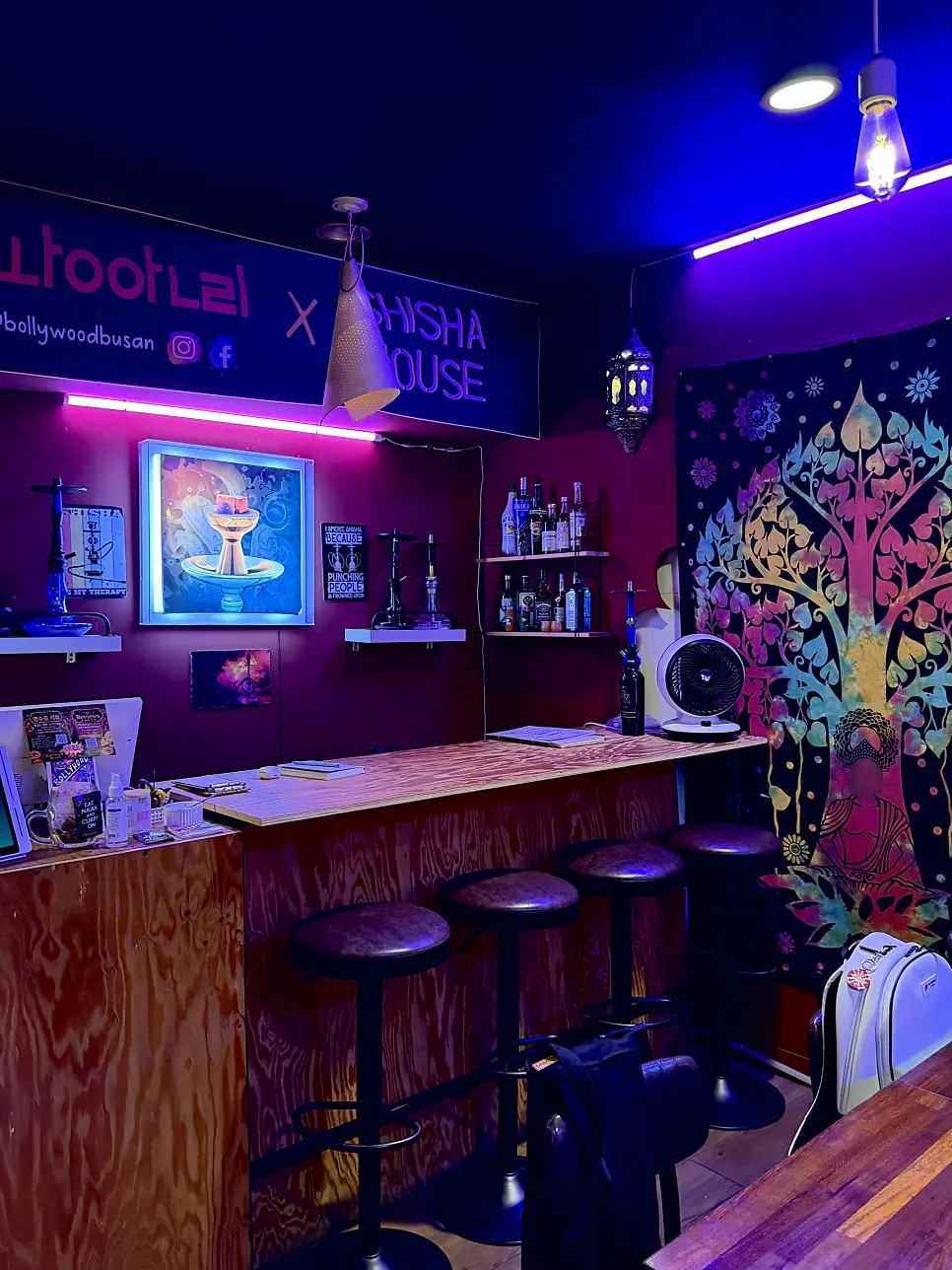 Wall with Indian-style painting and bar table