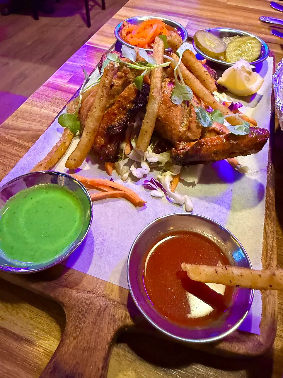A piece of crispy-outside, juicy-inside tandoori chicken