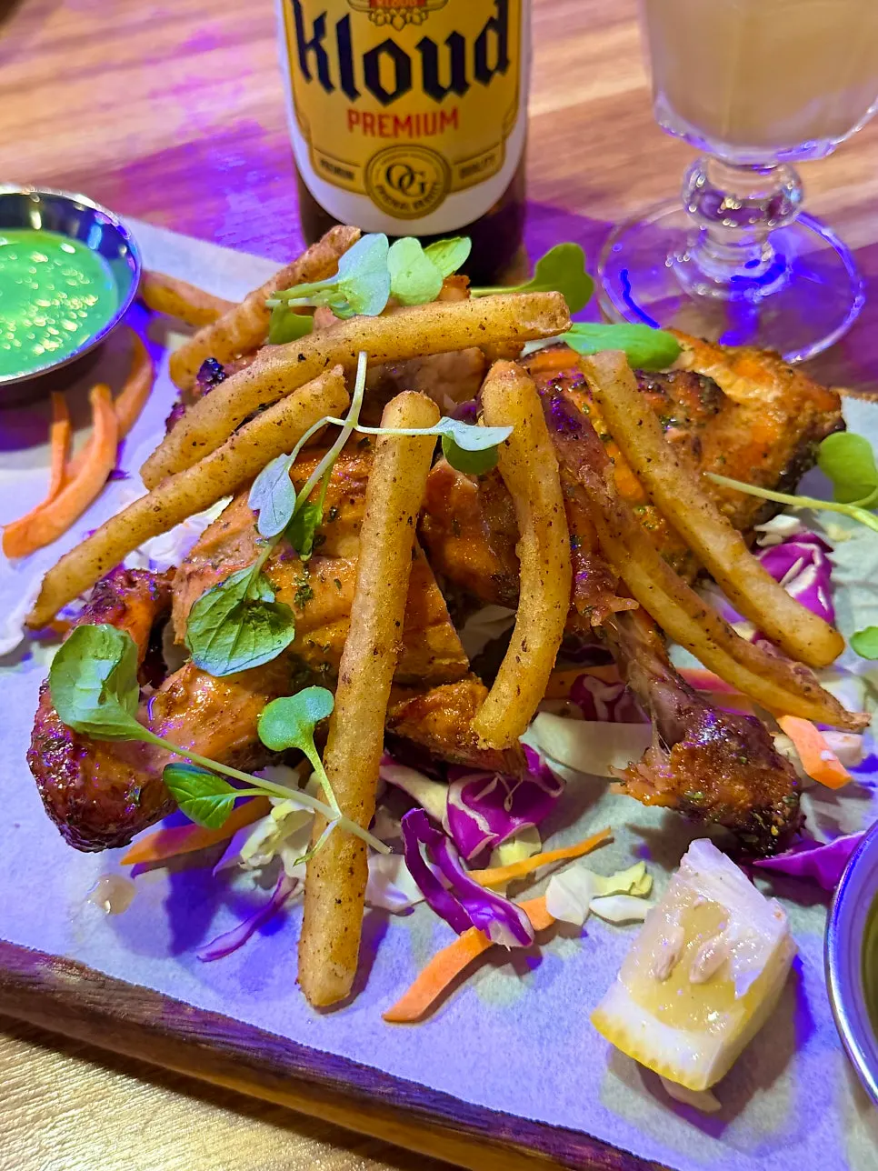 Close-up of tandoori chicken and fries