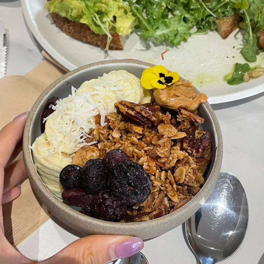 Acai bowl topped with fruit and peanut butter