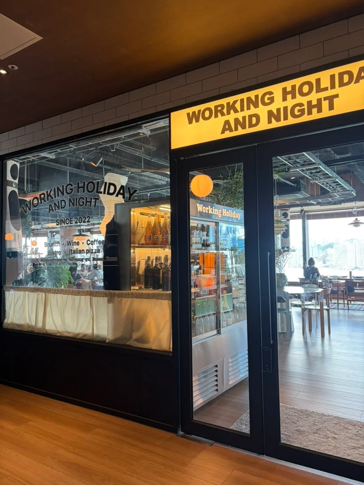 Exterior view of Working Holiday Minrak brunch café on the 7th floor of Bada Maru