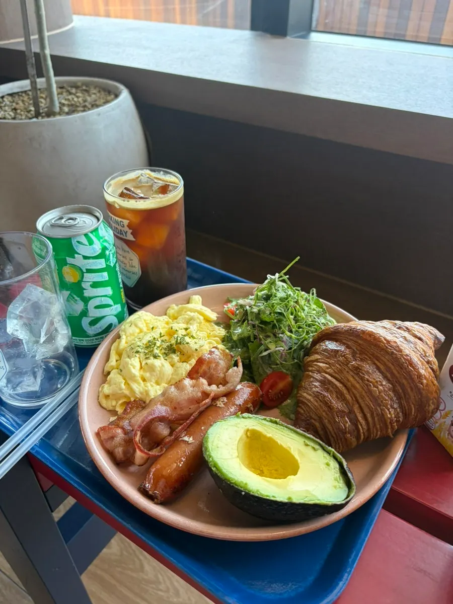 A full brunch spread laid out on a window table