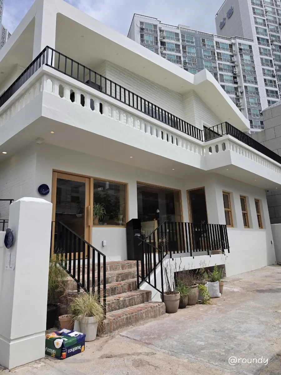 Extra Mile exterior resembling a white house