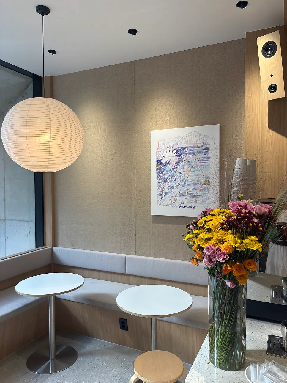 Tables and chairs on the 1st floor of Famous Benny Gwangalli Branch