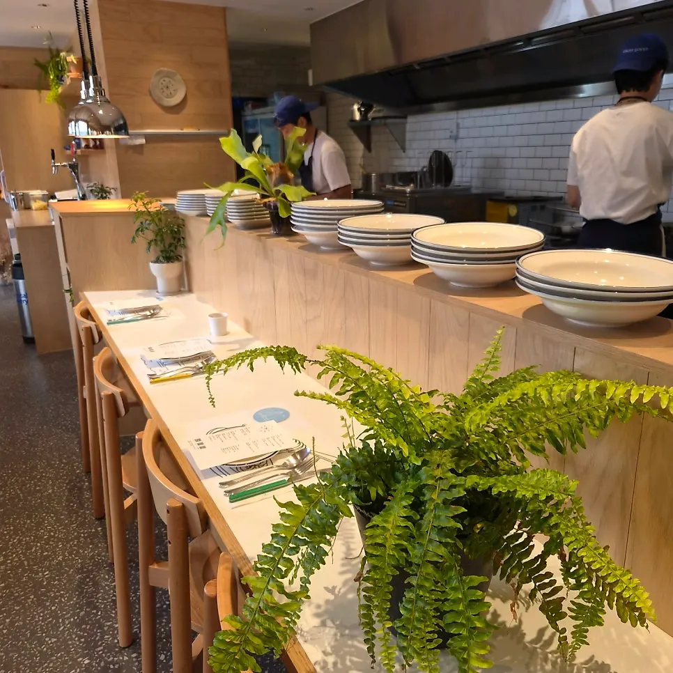 Restaurant seating full of guests even on a weekday early lunch