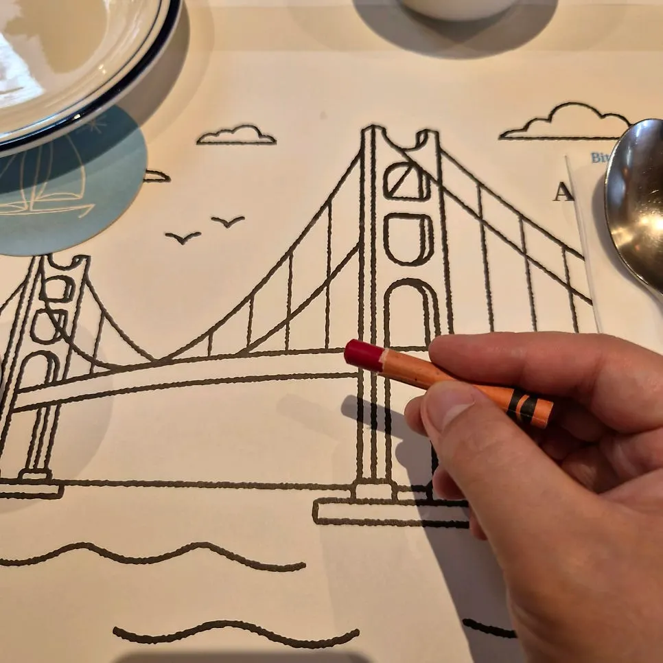 Paper and crayons set out on the table