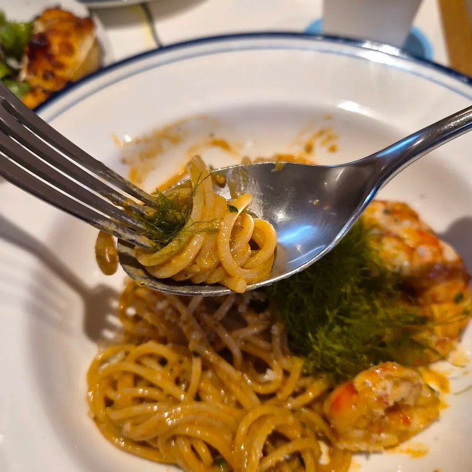 Pasta plate emptied down to the sauce