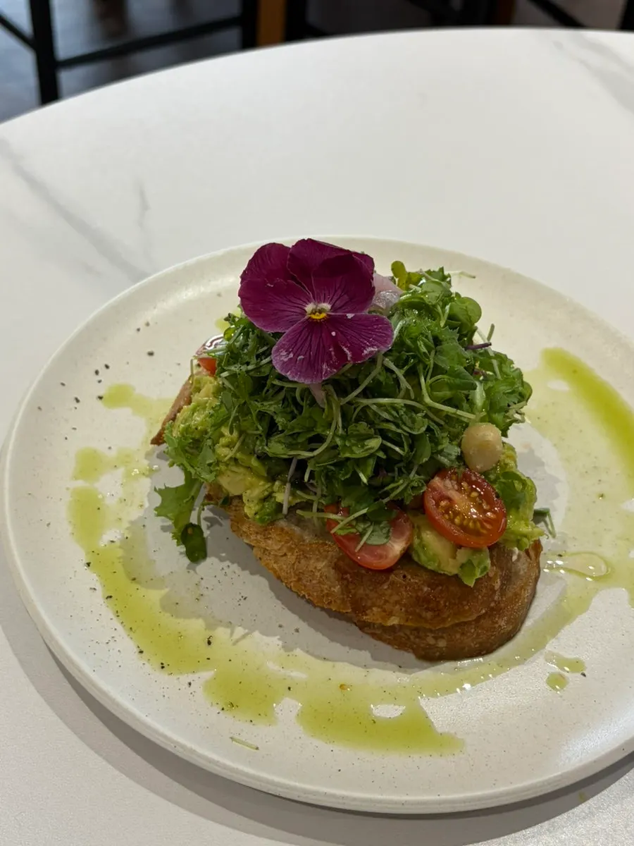 Plate of grilled mushroom toast with toppings still remaining