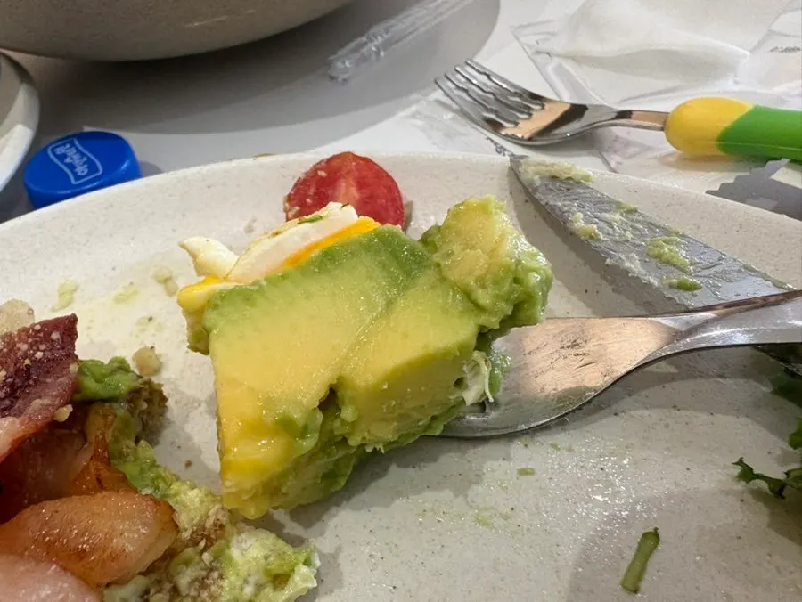 Cross-section of toast piled high with avocado
