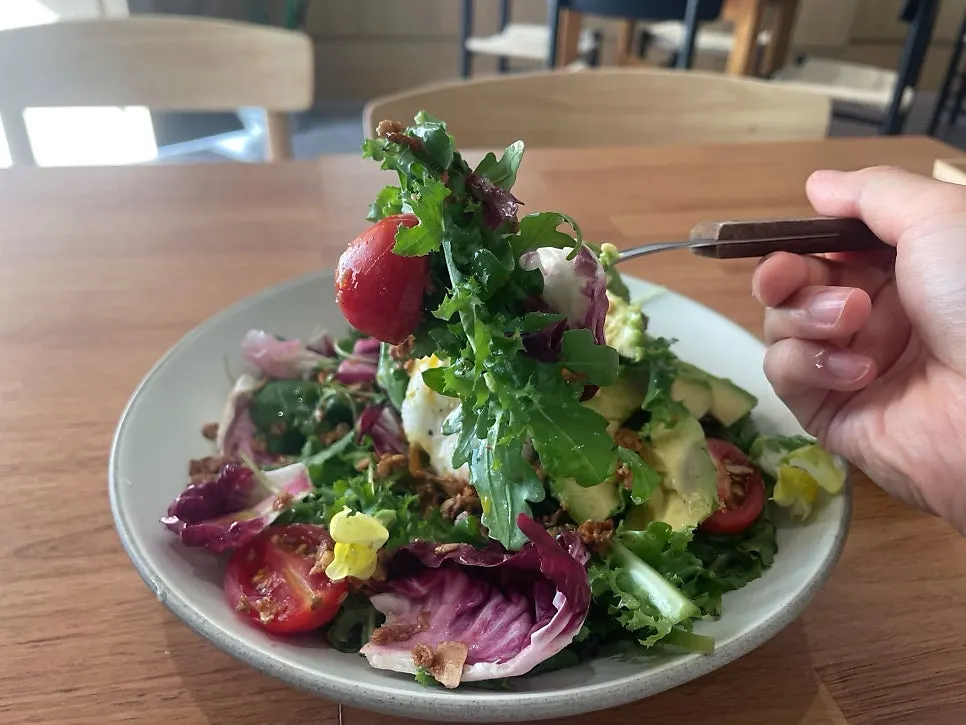 House salad with homemade granola and cherry tomatoes