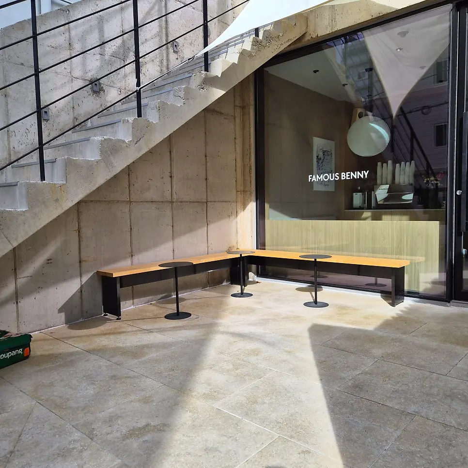 Outdoor table and seating in front of the shop door
