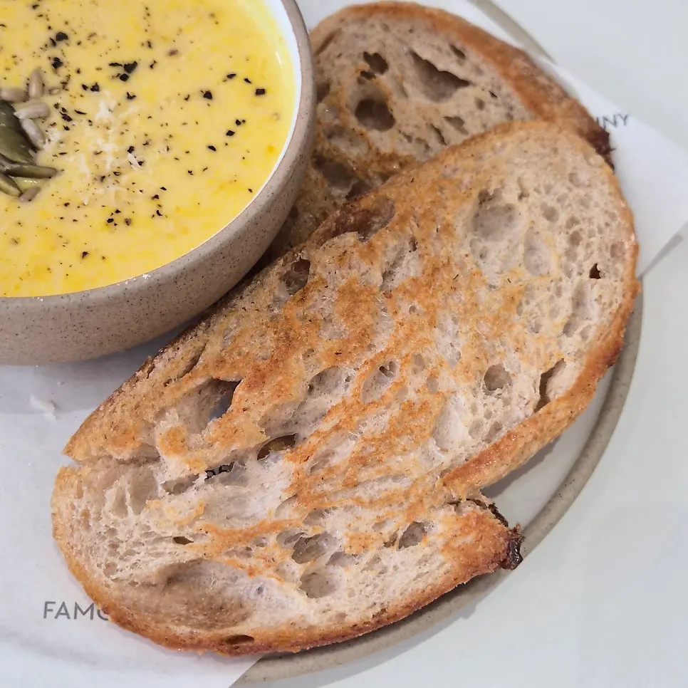 Grilled bread served with the sweet pumpkin soup