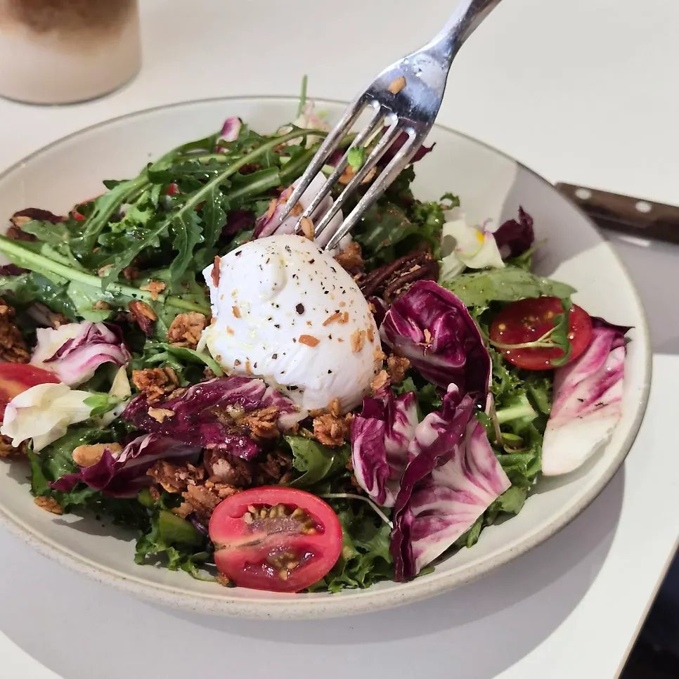 Salad with lemon dressing drizzled on top