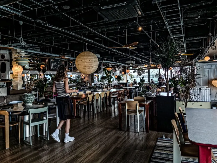 Exotic café interior with open kitchen