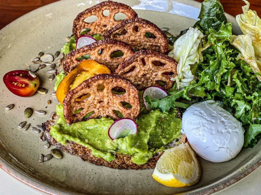 Plate of smashed avocado open sandwich